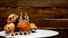 Pies With A Number 43  Of Candles Burning For The Anniversary. Copy Space Background Happy Birthday On Wooden Background. Card Or Postcard Festive Rustic Brown.