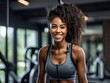 © burak duman - Smiling young black woman fitness model in sportswear doing exercise