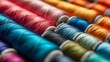Colorful cotton threads on tailor textile fabric with sewing needles for tailoring concepts