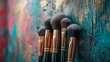 Fototapeta Do akwarium - A chic makeup brush set arranged against a backdrop of artistic graffiti.