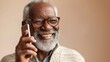 The image depicts an elderly man with a joyful expression wearing glasses and a sweater holding a smartphone to his ear suggesting he is engaged in a conversation or perhaps listening to a message.
