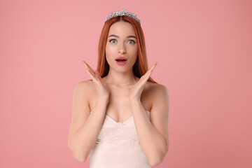 Poster - Emotional young woman with tiara on pink background, space for text