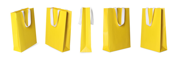 Wall Mural - Yellow shopping bag isolated on white, different sides