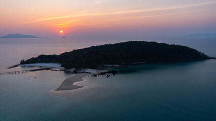 Wall Mural - Sunset view at Koh Kham There is a wooden pier stretching into the sea in Trat Province, Thailand.