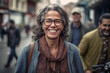 portrait of a smiling middle aged South American woman with glasses