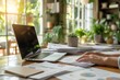 © radekcho - At the desk working person on laptop computer with a pile of documents on table in office. Overwork and excess responsibilities at work.