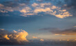 © Katerryna.R - Blue sky clouds background. Beautiful landscape with clouds and orange sun on sky