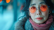 © yaqui_villegas - Portrait of a 60 year old Japanese woman with modern glasses in winter