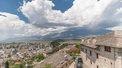 Sticker - Panorama showing Gjirokastra city from the viewpoint with many typical historic houses of Gjirokaster timelapse.