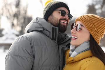 Wall Mural - Beautiful happy couple spending time together on winter day