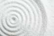 Leinwandbild Motiv Zen rock garden. Circle pattern on white sand, top view