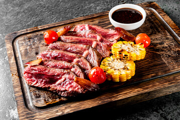 Wall Mural - Cooked sliced beef steak rare with sauce