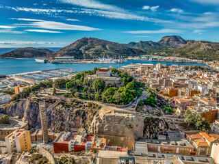 Poster - Aerial view of Cartagena port city in Spain surrounded by bastions and fortifications, medieval castle hill, roman amphitheater, bull ring, 