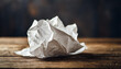 Crumpled white paper symbolizing creativity, ideas, and potential, isolated on rustic background