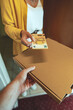 © M-Production - Man delivering pizza in box and taking payment.