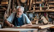 © Daniela - Skilled elderly carpenter plans a wooden board in the workshop with a planer.