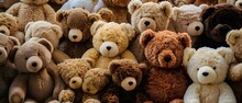 Large Group Of Teddy Bears Sitting Together In A Pile Together, All With Different Colored Faces And Noses, Toy