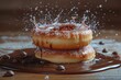 Donuts with sugar glaze are dynamically dipped into liquid chocolate with splashes
