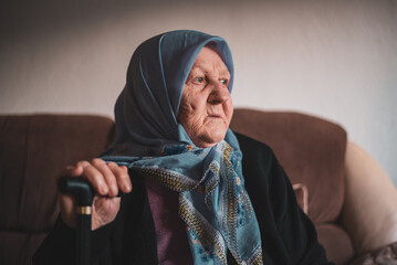 Beautiful face portrait of a happy Muslim grandmother in hijab.