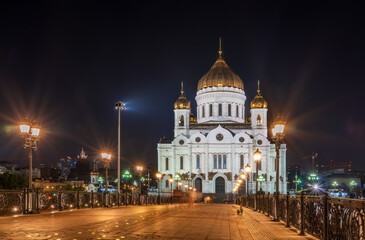 Cathedral of Christ the Savior and Patriarshy bridge at night in Moscow, Russia