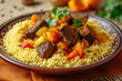 plate of couscous, a North African dish with steamed semolina grains, served with meat, vegetables