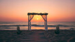 © Nemanja - Romantic scene of the sea or ocean sand beach wedding at the sunset with bouquets of rose flowers and chairs for the guests. No people, nobody, copy space. Summer marriage ceremony, holiday engagement