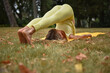 © Natalje Dietrich - A middle-aged woman is doing yoga in the park