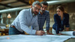 © Daniel - Group of People Examining a Blueprint Architects planning