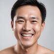 © Antonio Giordano - Closeup portrait of happy asian man face, isolated on white background with copy space.