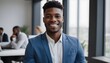 © Antonio Giordano - Friendly and smiling young african american professional businessman looking at camera in modern office