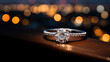 Diamond engagement ring on a reflective surface with soft bokeh city lights in the background.