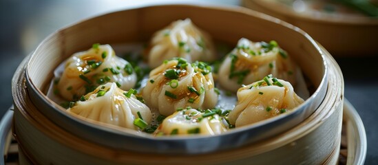 Sticker - A delicious dish of steaming dumplings fills the bamboo steamer, showcasing the culinary artistry of this vegetable-based recipe.