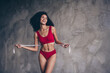 © deagreez - No retouch portrait of lovely confident girl with chevelure hairdo wear red top panties mesure waist isolated on gray concrete background