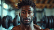 © Jammy Jean - Closeup portrait of handsome black fitness male model inside a workout area in his gym.