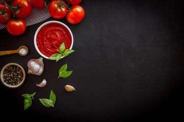 Wall Mural - Tomato sauce passata in bowl with fresh tomatoes and basil