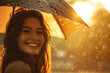Beaming smile of a lady under an umbrella amidst sunlit rain