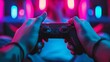© Zahid - Close-up of hands playing the video game at night