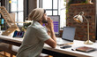 © Wavebreak Media - Young Asian man ponders at his casual business office desk, with copy space