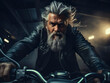 © Maxim Chuev - Portrait of alone , one bearded grey haired confident stylish hipster biker sitting on motorcycle against night garage background. brutal middle aged man wearing black leather jacket. long grey hairs