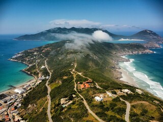 Poster - Aerial view of the beach and a town in the foreground, with distant islands seen in the background