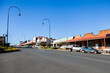 © Austockphoto - Main street in Gundagai NSW with cars parked and blue sky