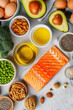  foods rich in omega 3. red fish steak, olive oil, avocado, walnuts, eggs, flax seeds and chia seeds, broccoli. healthy eating concept. nutritional value of foods. selective focus