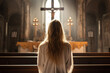 Back view of young woman in catholic church