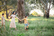 © Austockphoto - Portrait of mother and children walking together in Australian bush setting
