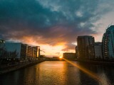 Fototapeta  - Scenic image captures the beauty of a river at sunset in Manchester