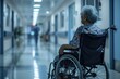 © Alina - Disabled senior woman sitting in wheelchair in hospital