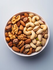 Wall Mural - mixed nuts in bowl. Mix of various nuts on colored background. pistachios, cashews, walnuts, hazelnuts, peanuts and brazil nuts. : Generative AI