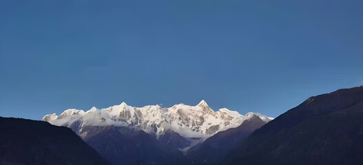 Canvas Print - the mountains are full with snow on the top and a mountain is behind them