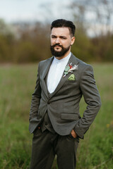 portrait of a young bearded guy groom