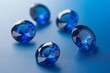 sapphires placed on a gradient blue background